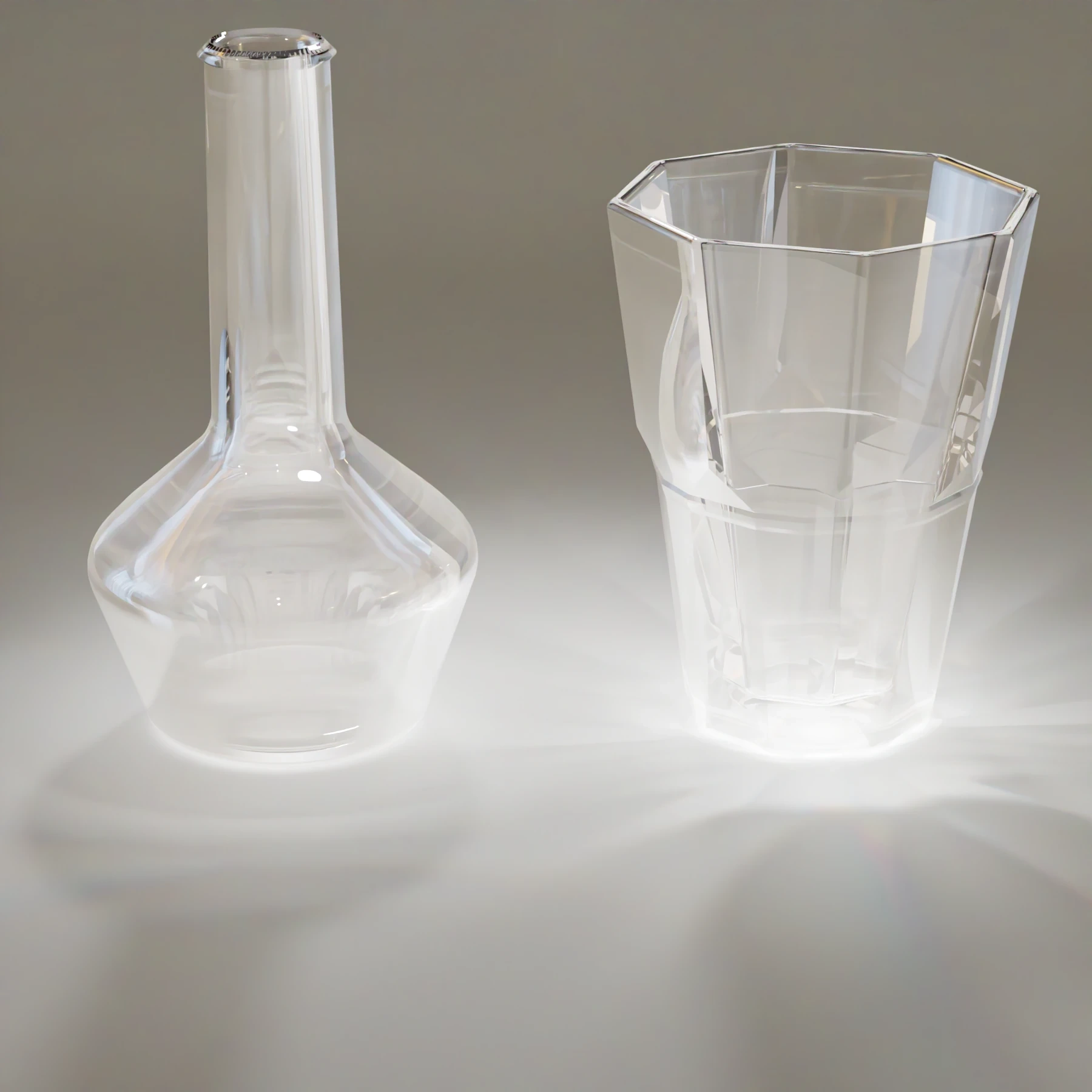 A closer view of the glass flask and tumbler, with the tumbler's facets and the curve of the neck reflecting bands of light and thin rays of brightness around the base.